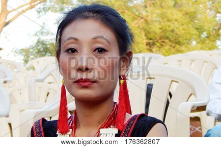 HYDERABAD,INDIA-MARCH 3:Closeup portrait of North eastern tribal woman dancer,with details of ornaments and dress in Shilparamam on March 3,2017 in Hyderabad,India