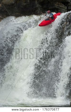Kayaker in the waterfall in Norway Ula river