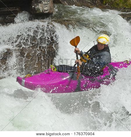 Kayaker in the waterfall in Norway Ula river
