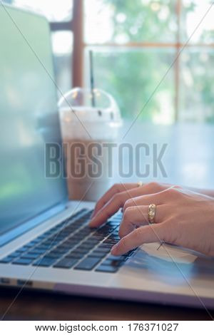 Woman Hands Typing On Laptop stock photo