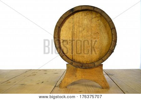 background of barrel and worn old table of wood and kerosene lamp