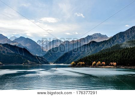 Beautiful Tianshan and Tianchi( heavenly Mountain and Lake) in Xinjiang, China.Tianchi Lake \'s elevation is 1980 meters, 3.5 kilometers long from north to south, the deepest place of the lake is 103 meters.