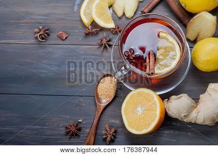 Cup Of Ginger Tea With Lemon And Honey On Dark Brown Wooden  Background