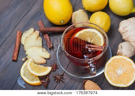 Cup Of Ginger Tea With Lemon And Honey On Dark Brown Wooden  Background