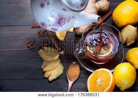 Cup Of Ginger Tea With Lemon And Honey On Dark Brown Wooden  Background