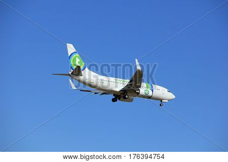 Amsterdam the Netherlands - July 15th 2016: PH-XRB Transavia Boeing 737 approaching Polderbaan runway at Schiphol Amsterdam Airport arriving from Lisbon Portugal