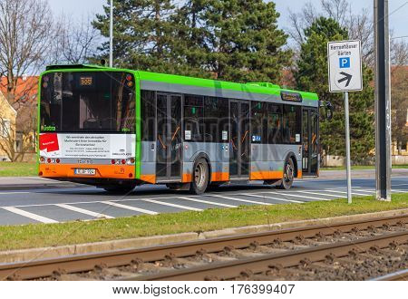 HANNOVER / GERMANY - MARCH 12 2017: regular bus from UESTRA drives on route to the next stop. UESTRA is the operator of public transport in the city of Hanover Germany