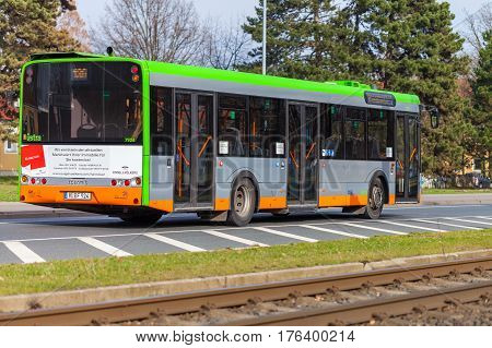 HANNOVER / GERMANY - MARCH 12 2017: regular bus from UESTRA drives on route to the next stop. UESTRA is the operator of public transport in the city of Hanover Germany