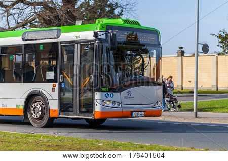 HANNOVER / GERMANY - MARCH 12 2017: regular bus from UESTRA drives on route to the next stop. UESTRA is the operator of public transport in the city of Hanover Germany