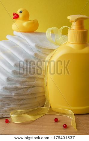 accessories for baby diapers on white background, banny, a bottle of water, cream