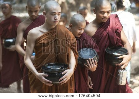 Monks Going for Lunch at Kalaywa Tawya Monastery in Yangon. February 23 2014 - Yangon Myanmar