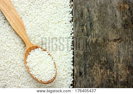 Rice on the old wooden background blank space for text