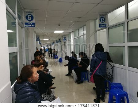 Hanoi, Vietnam - Sep 27, 2016: Asian patients waiting for their turns to be examined at 108 Military Central Hospital, also known in many variations as Army Medical Institute 108.