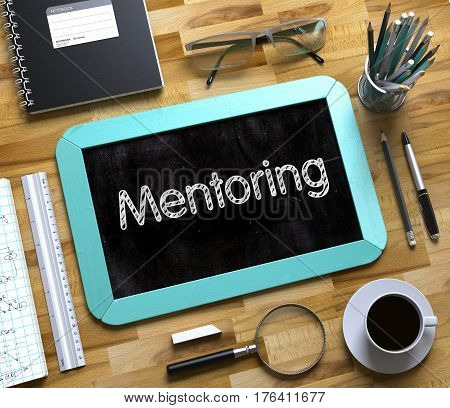 Mentoring Handwritten on Small Chalkboard. Mentoring. Business Concept Handwritten on Mint Small Chalkboard. Top View Composition with Chalkboard and Office Supplies on Office Desk. 3d Rendering.