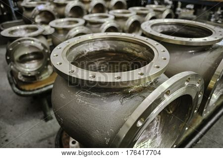 St. Petersburg Russia - February 13 2010: The Armalit factory produces ship armature for shipbuilding companies. Connecting pipes after machining on the production line.