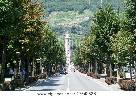 Tirano Italy - 22 July 2007: People on the avenue to Basilica of Madonna at Tirano on Italy