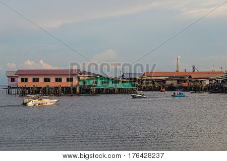 Labuan,Malaysia-March 15,2017:Evening scene of daily activities at Patau-Patau water village in Labuan,Malaysia.Patau-Patau water village is among famous place in Labuan Pearl Of Borneo,Malaysia.