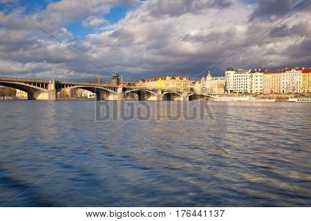 Prague Czech Republic - March 3 2017: View on the Prague panorama with Jirasek bridge after rain.The Prague bridges arching over the Vltava River are not only vital connecting links but also valuable works of architecture .