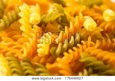 A handful of colored pasta screws for eating