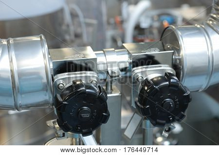 Gates, Taps, Monometers At The Pharmaceutical Plant. Open The Supply Of Medicine To The Reactor. Man