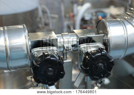 Gates, Taps, Monometers At The Pharmaceutical Plant. Open The Supply Of Medicine To The Reactor. Man