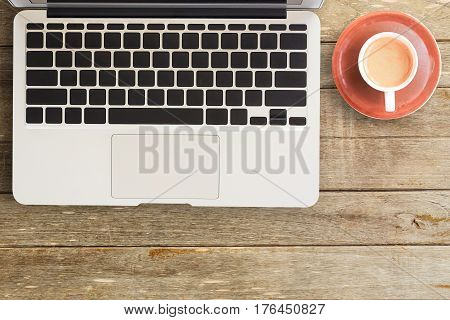 Notebooks and laptop with cup of coffee on office desk or wood table. top view with copy space for design