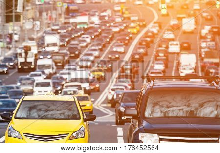 Heavy traffic on the city highway wuth sunlight effect