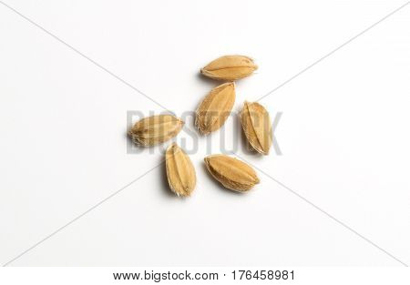 Close up of six natural rice grains