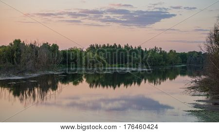 Rural scenery in the evening by the river. Ukraine. Europe.