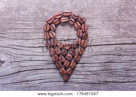 geolocation tag gps  from coffee beans on old wooden table