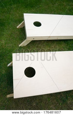 Wooden Cornhole Boards from Above on Grass