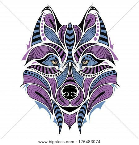 Patterned colored head of the wolf. African / indian / totem / tattoo design. It may be used for design of a t-shirt, bag, postcard and poster.