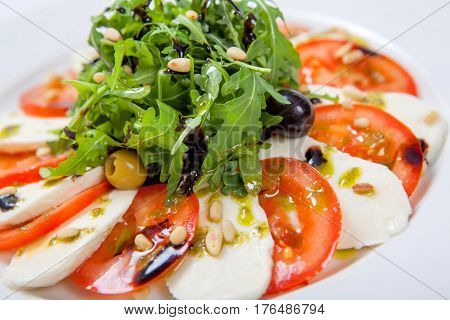 Caprese Salad. Fresh Salad With Fresh Juicy Tomatoes With Mozzarella Cheese And Fresh Arugula