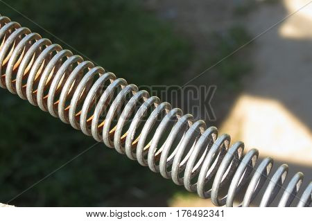 detail of a metal spring device outdoors