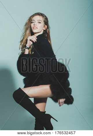 Pretty Sexy Woman With Long Hair In Fur And Jackboot