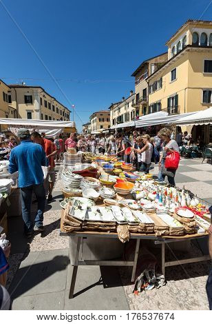 LAZISE ITALY - MAY 4 2016: The open air market in Lazise at Garda Lake. Italy