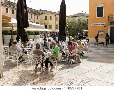 LAZISE ITALY - APRIL 30 2016: Shops bars and restaurants in Lazise at Garda Lake. Italy
