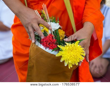 Offer sacrifice flowers to monk, Buddhist  religion