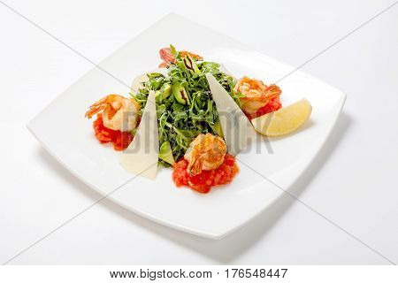 Arugula Fresh Salad With Avocado Slices With Parmesan Cheese And Fried Shrimp Flavored With Balsamic