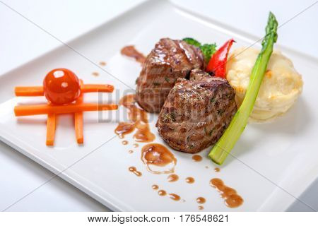 Medallions Of Grilled Veal With Potatoes And Broccoli.