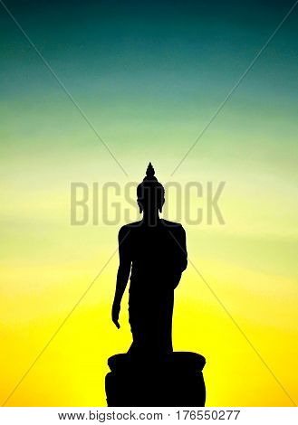 Sunset in Buddhist park in the Phutthamonthon district Buddhamonthon. Nakhon Pathom Province of Thailand. (Silhouette of Buddha)