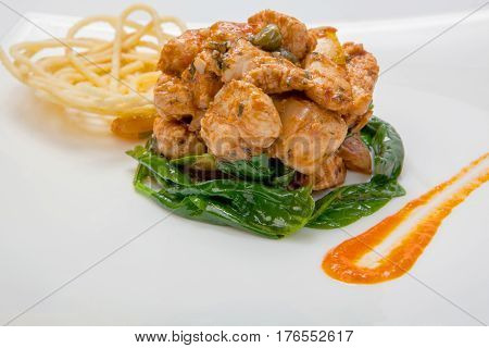 Fried Chicken In Sweet And Sour Sauce With French Fries.