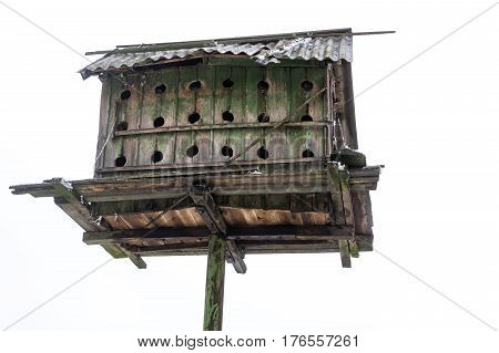 Old Ukrainian wooden dovecote against white background