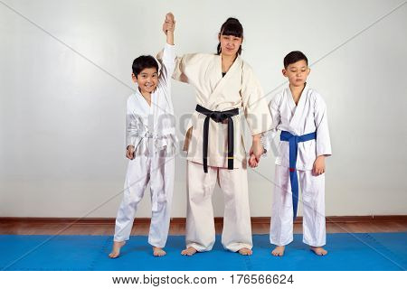 Coach Woman Raises Her Hand To The Winner Of The Sparring