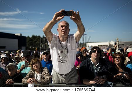 Fatima Portugal - May 13 2014: Crowd of people at the Sanctuary of Fatima during the celebrations of the apparition of the Virgin Mary in Fatima Portugal.