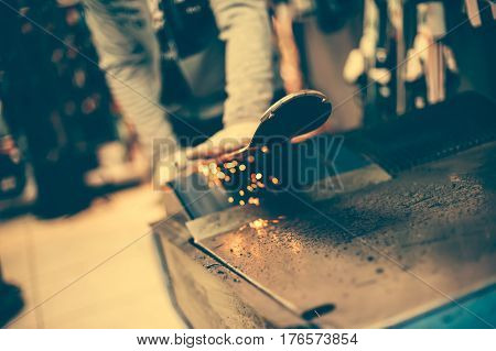 Ski Tuning And Reapairs. Winter Shop Worker Doing Base Repair
