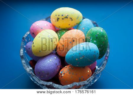 Easter Eggs In A Crystal Dish On A Blue Background,