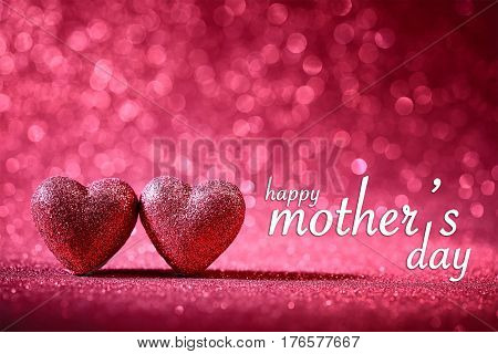 happy mother's day theme with two pink hearts