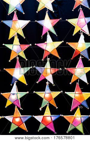 Multi colored star lamps and background .