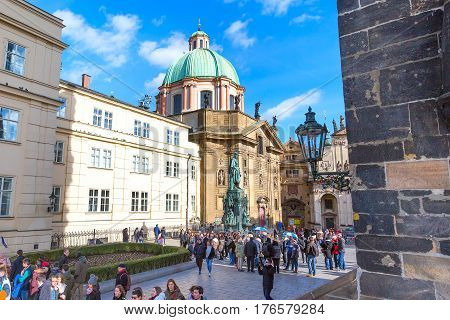 Prague, Czech Republic - February 25, 2017: People near the statue of Charles IV at Knights of the Cross Square